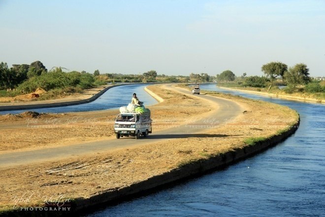 Kinjhar-Gujjo canal running beside the highway